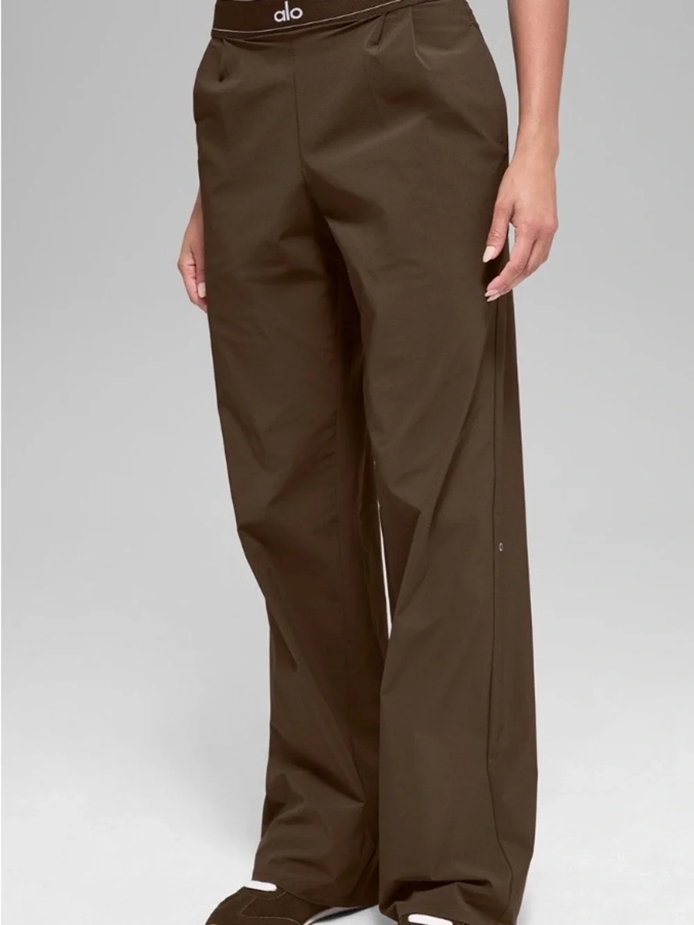 ALO Yoga female, espresso trousers.